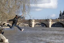JR at the Pont-Neuf Paris, February 2026 - JR saute au dessus de la Seine